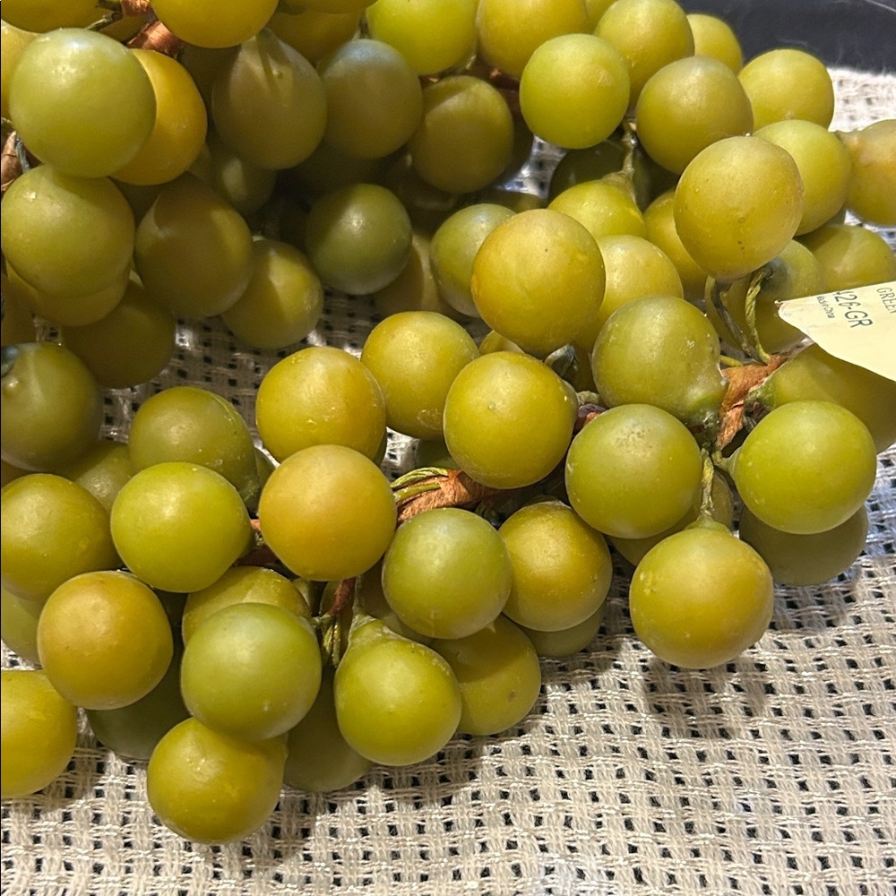 Three bunches of faux grapes